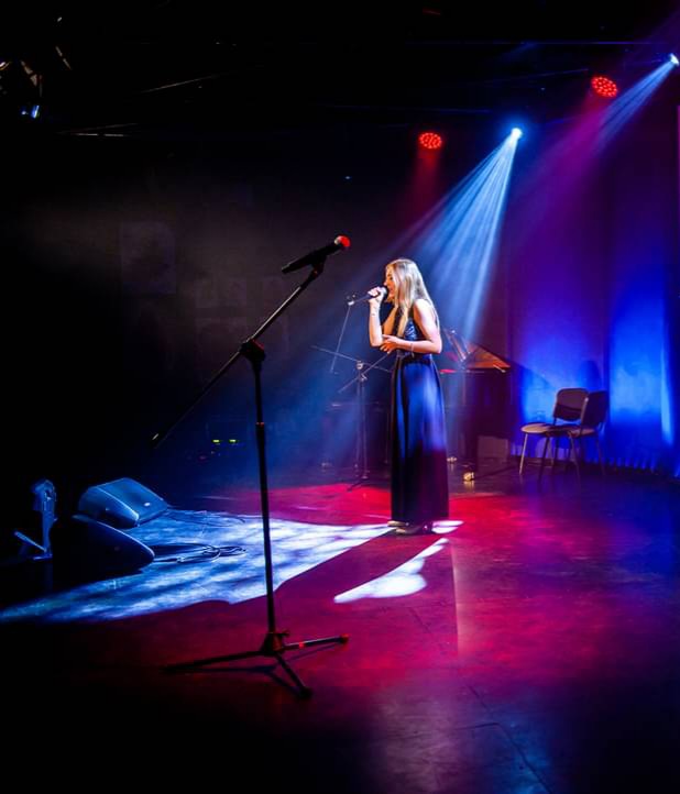 Agata singing at a competition